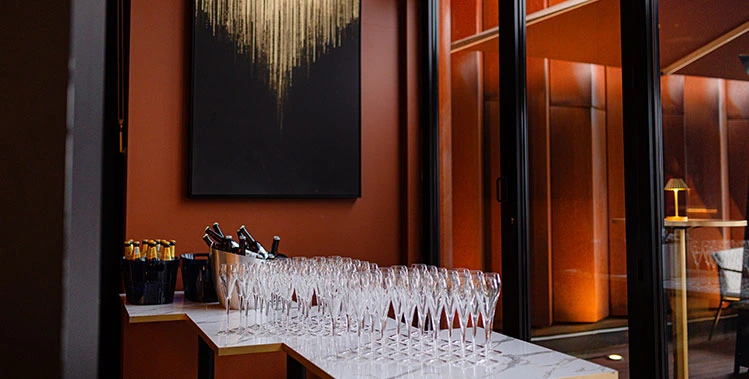 Corporate event reception at Uyare with champagne glasses ready